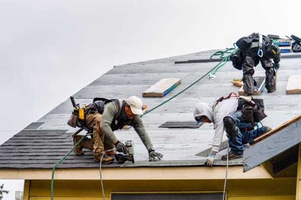 Professional Roofing technician working in Ruby, NY